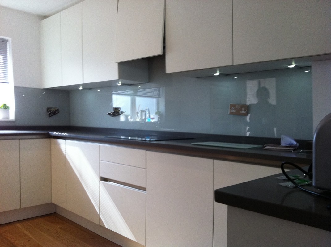 Grey glass kitchen splashback with LED lighting in West Ealing