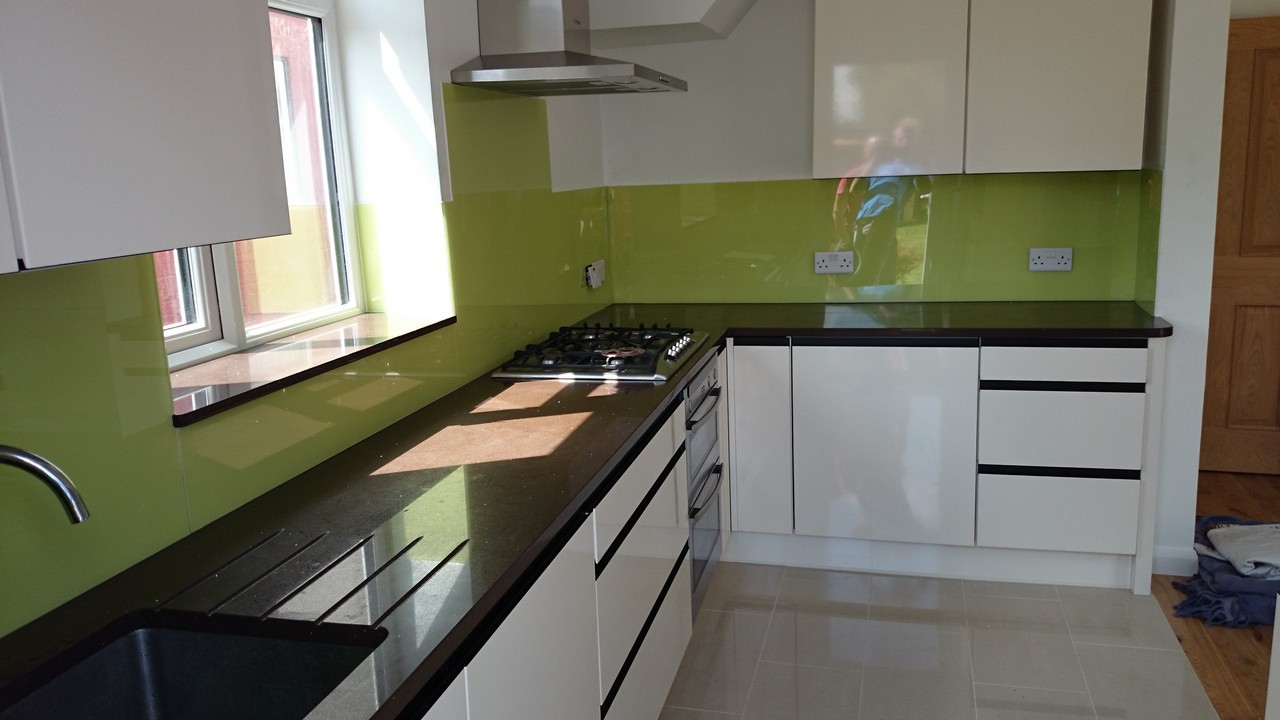 Lime green glass kitchen splashback installed by West Ealing glaziers
