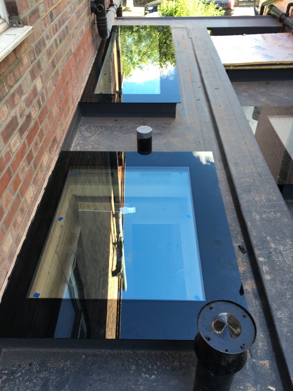 Multiple flat roof skylights on extension in West Ealing